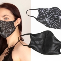 alt="black wet look face mask made of cotton lining and polyester exterior"
